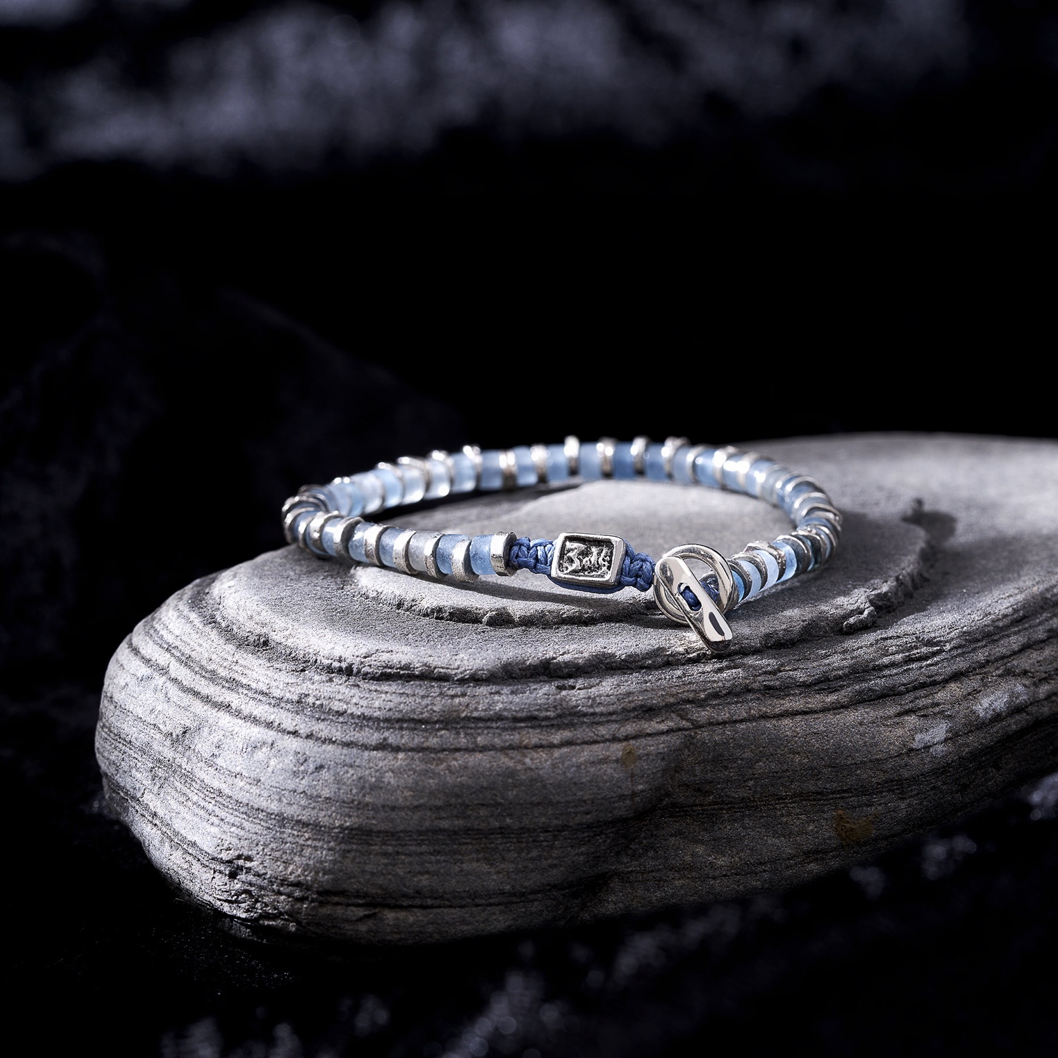 Blue bracelet on stone