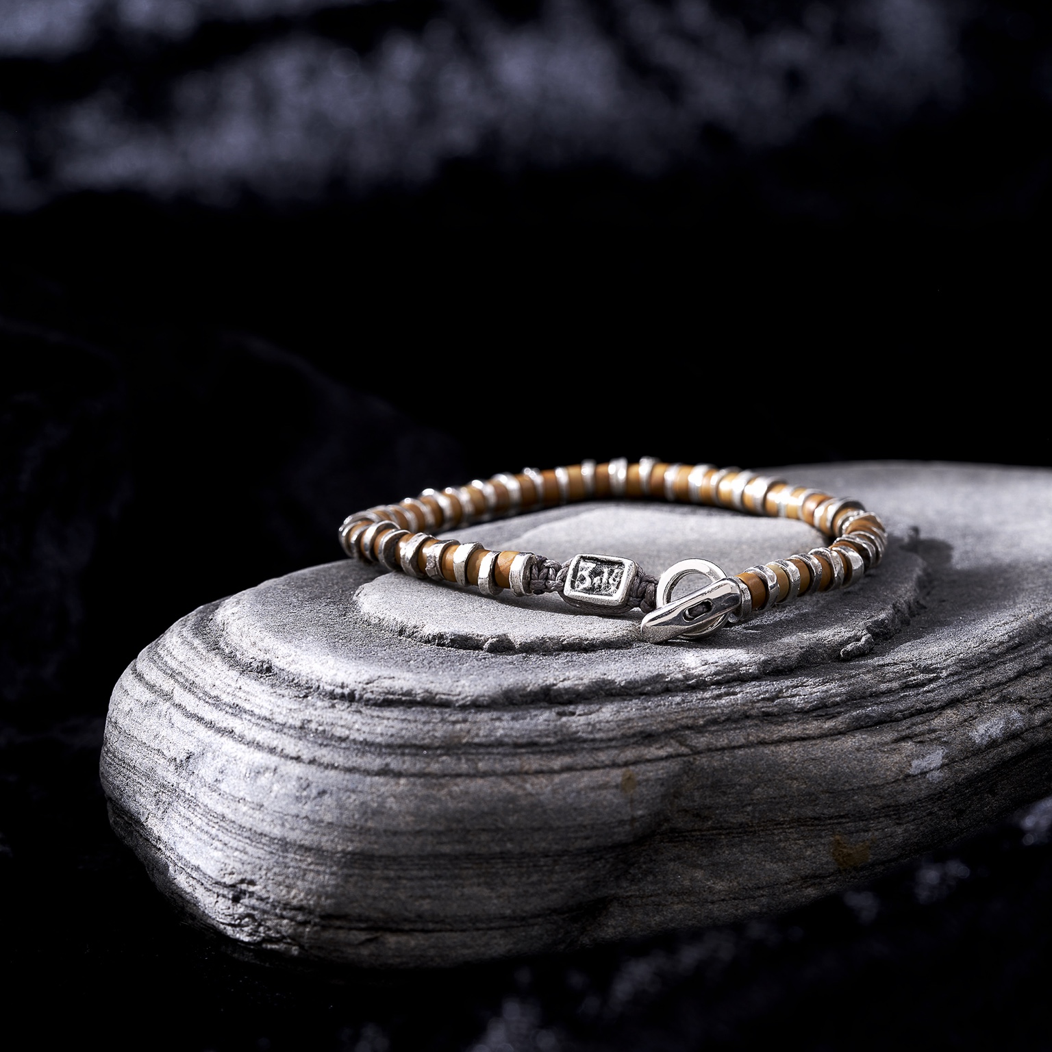 Brown bracelet on stone